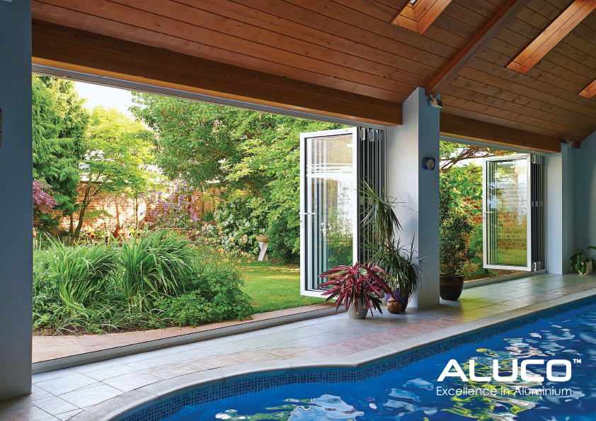 Bi fold doors in front of a lovely swimming pool