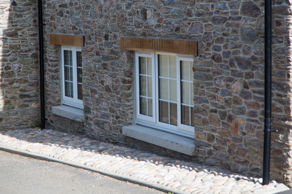 White windows on a stone house